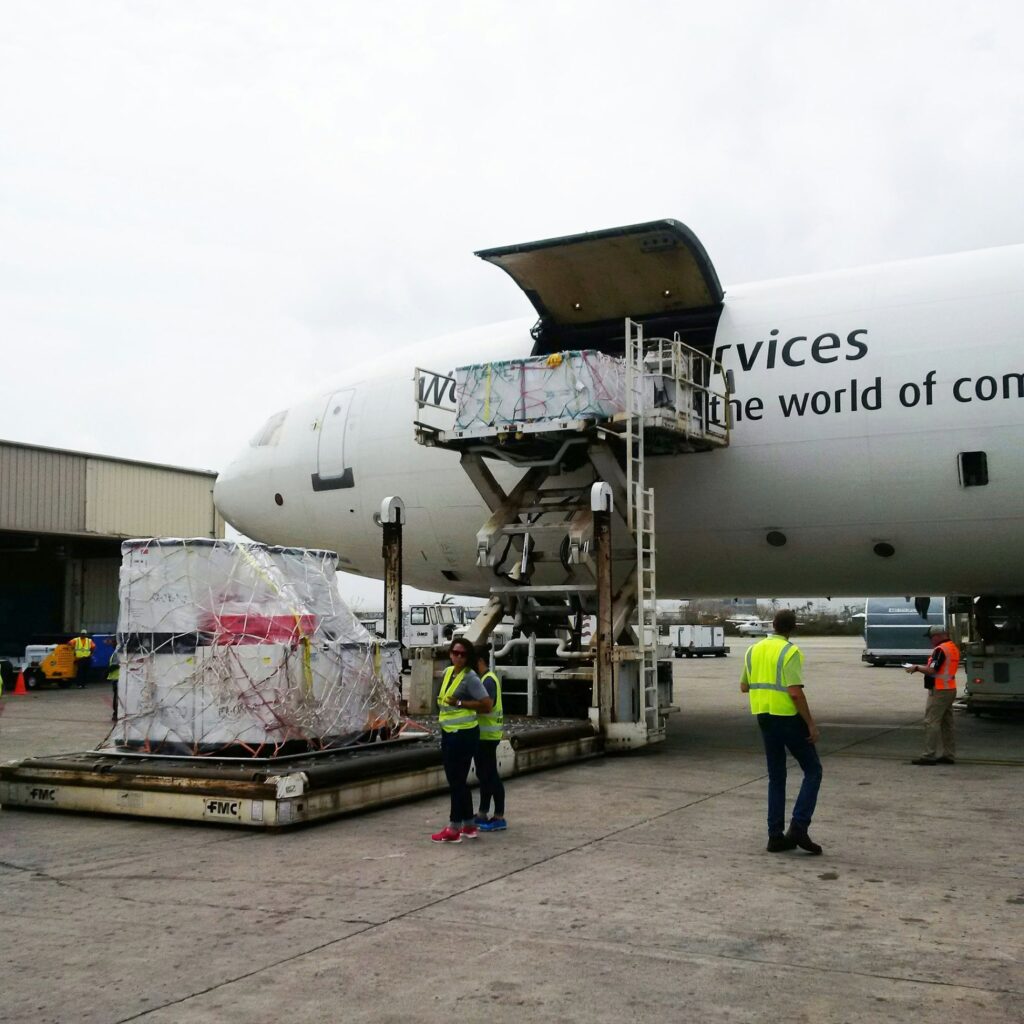 Air crew loading a pallet into the hold
